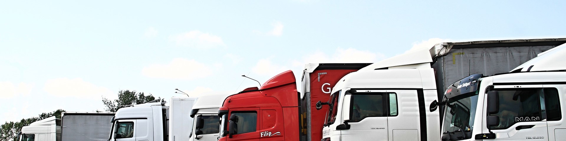 Several lorries lined up next to each other 