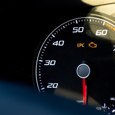 Clear image of vehicle dashboard showing warning lights
